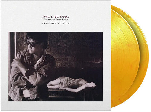 Paul Young: Between Two Fires - Limited & Expanded 180-Gram Flame Colored Vinyl [ Vinyl ]